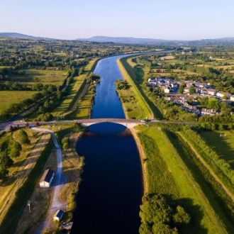 Aerial view clonlara village river shannon east co clare master medium custom cms-county-arms-hotel